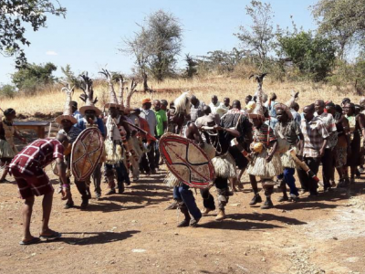 Community members celebrating with sacred dance after ritual ceremony